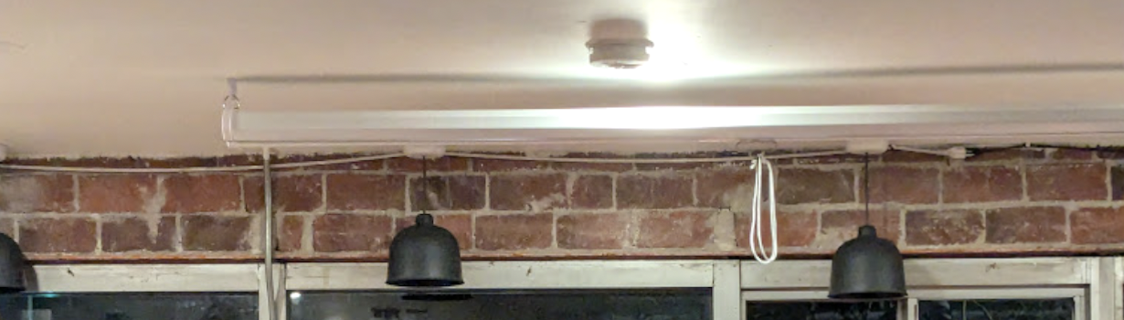 Still in the street on which cars are also passing